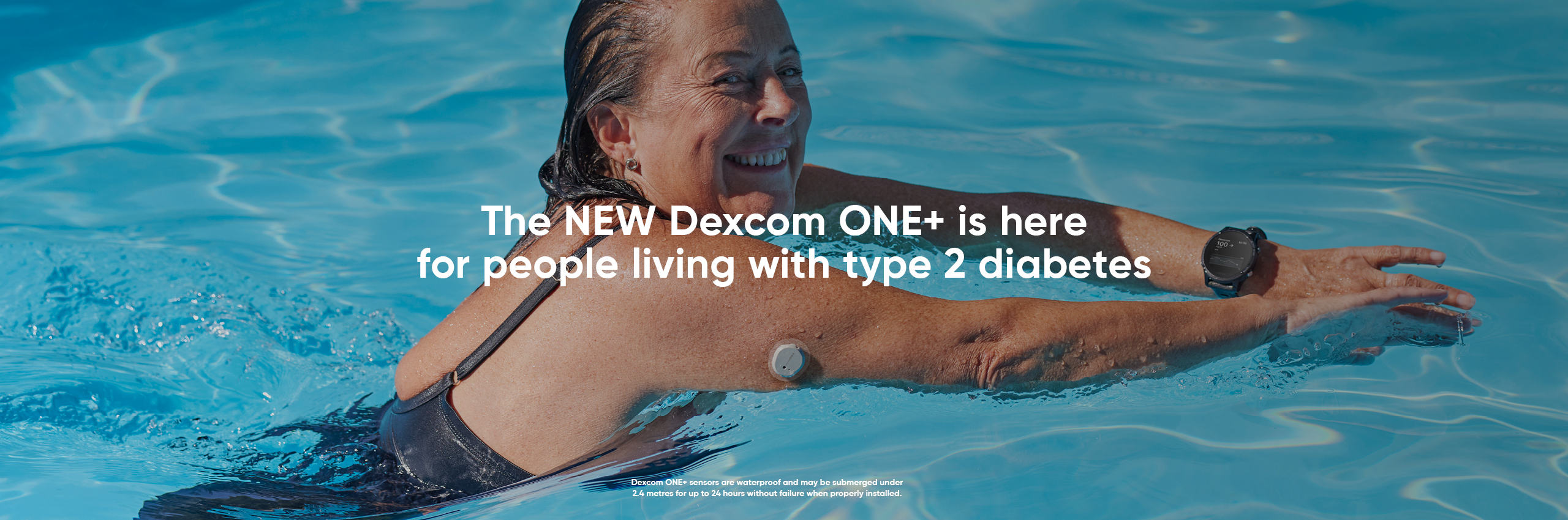A women swims in a pool while wearing Dexcom CGM