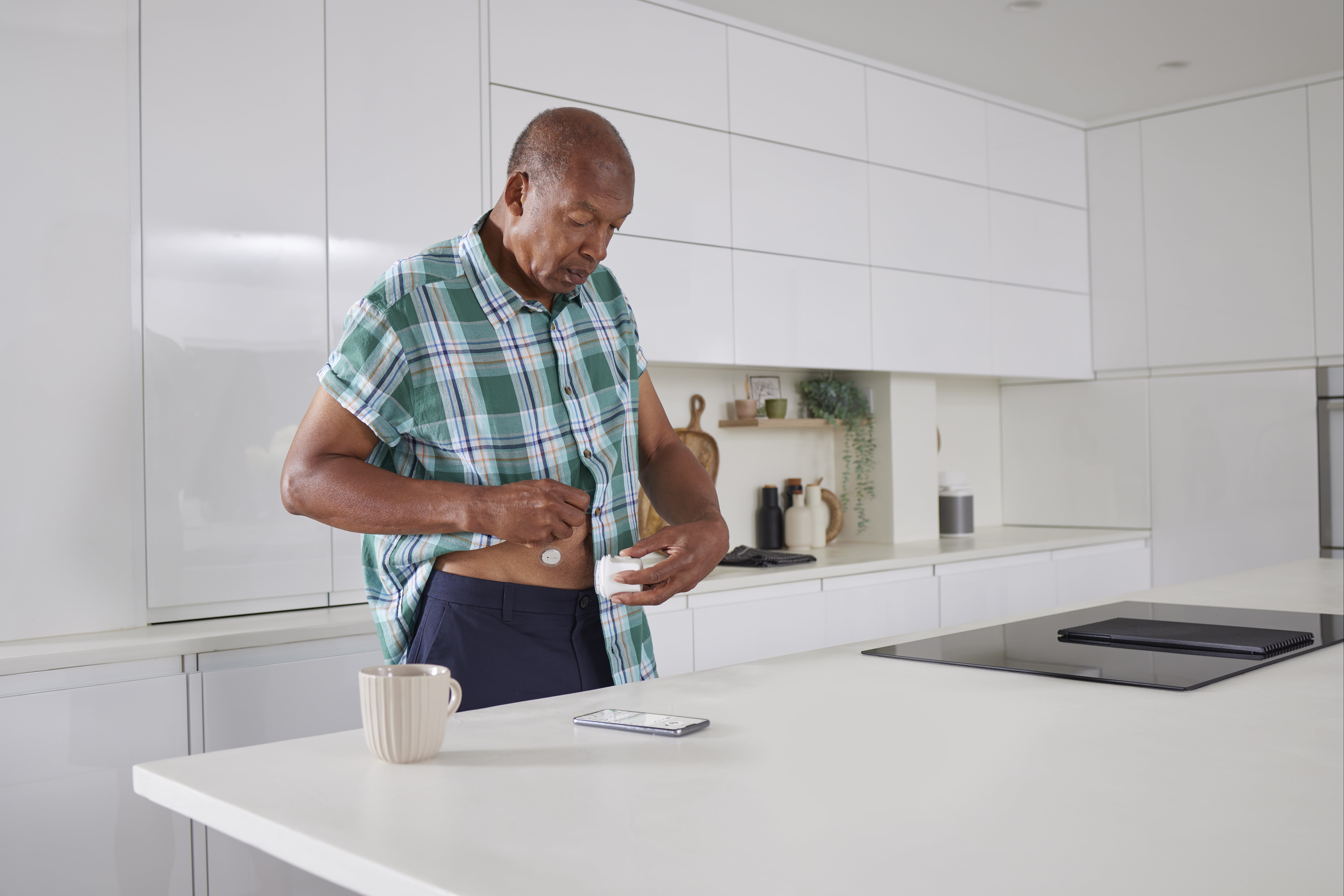Dexcom ONE+ man applying sensor
